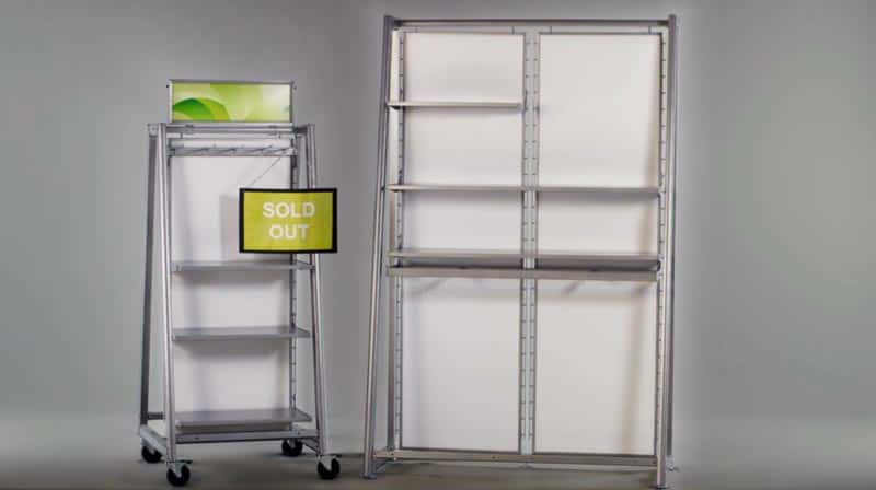 Metal shelves on a white background with a green sold out sign