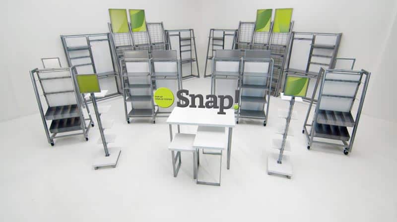 Metal shelves and creates and white desks on a white background