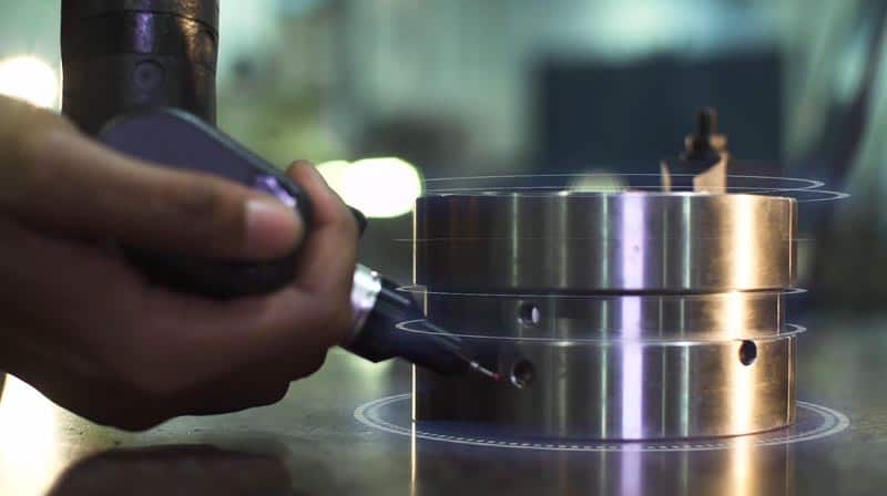 An industrial worker welds a metal pipe with animation