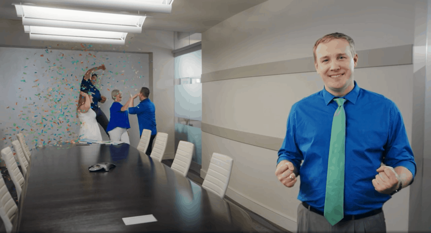 Mortgage loan officer celebrate in a conference room with confetti