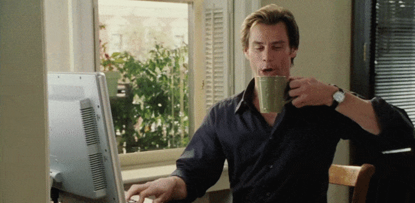 Jim Carey drinks coffee and types on a keyboard quickly