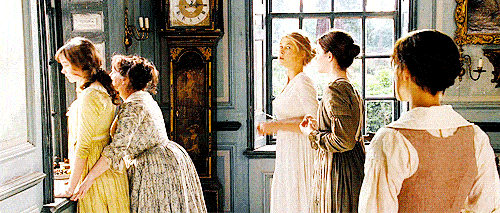 The Bennet sisters turn to see Mr. Darcy and Mr. Bingley