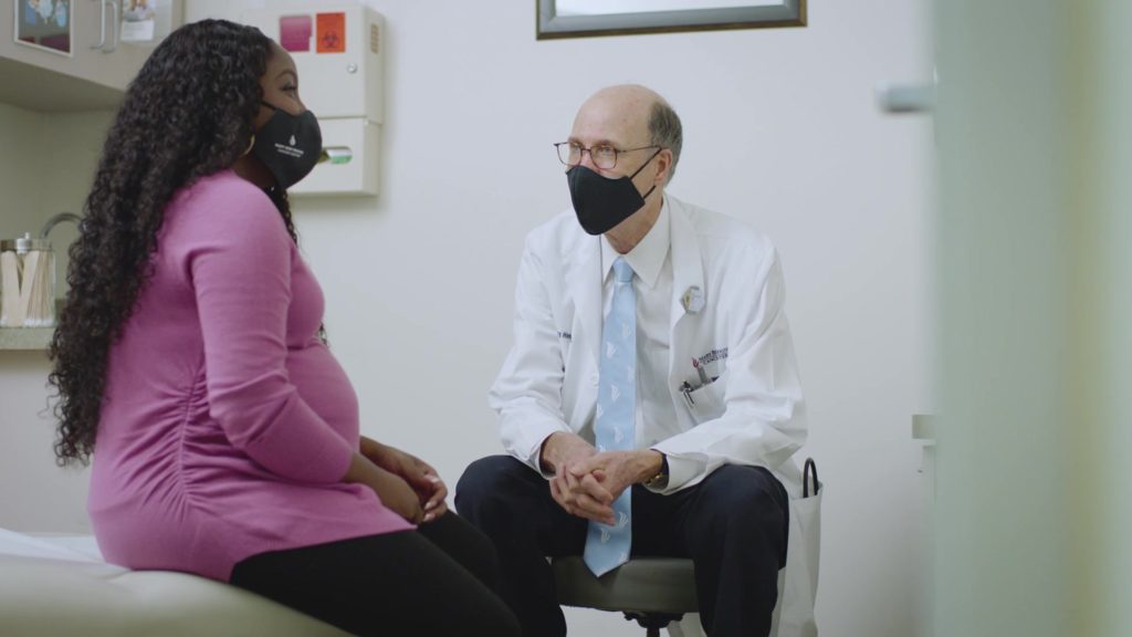 client speaks with physician 