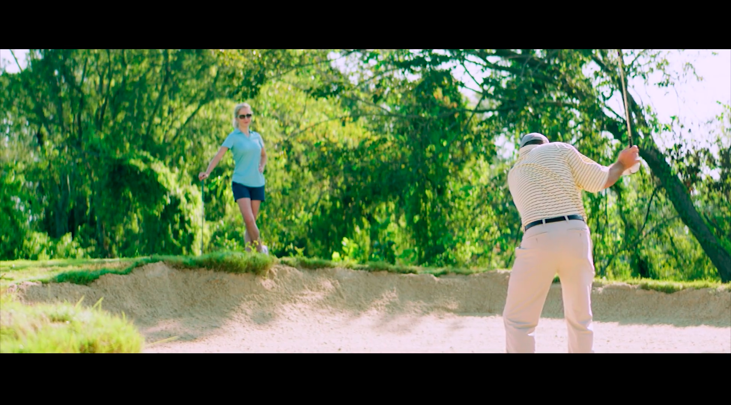 Older couple golfing in Live Action marketing video
