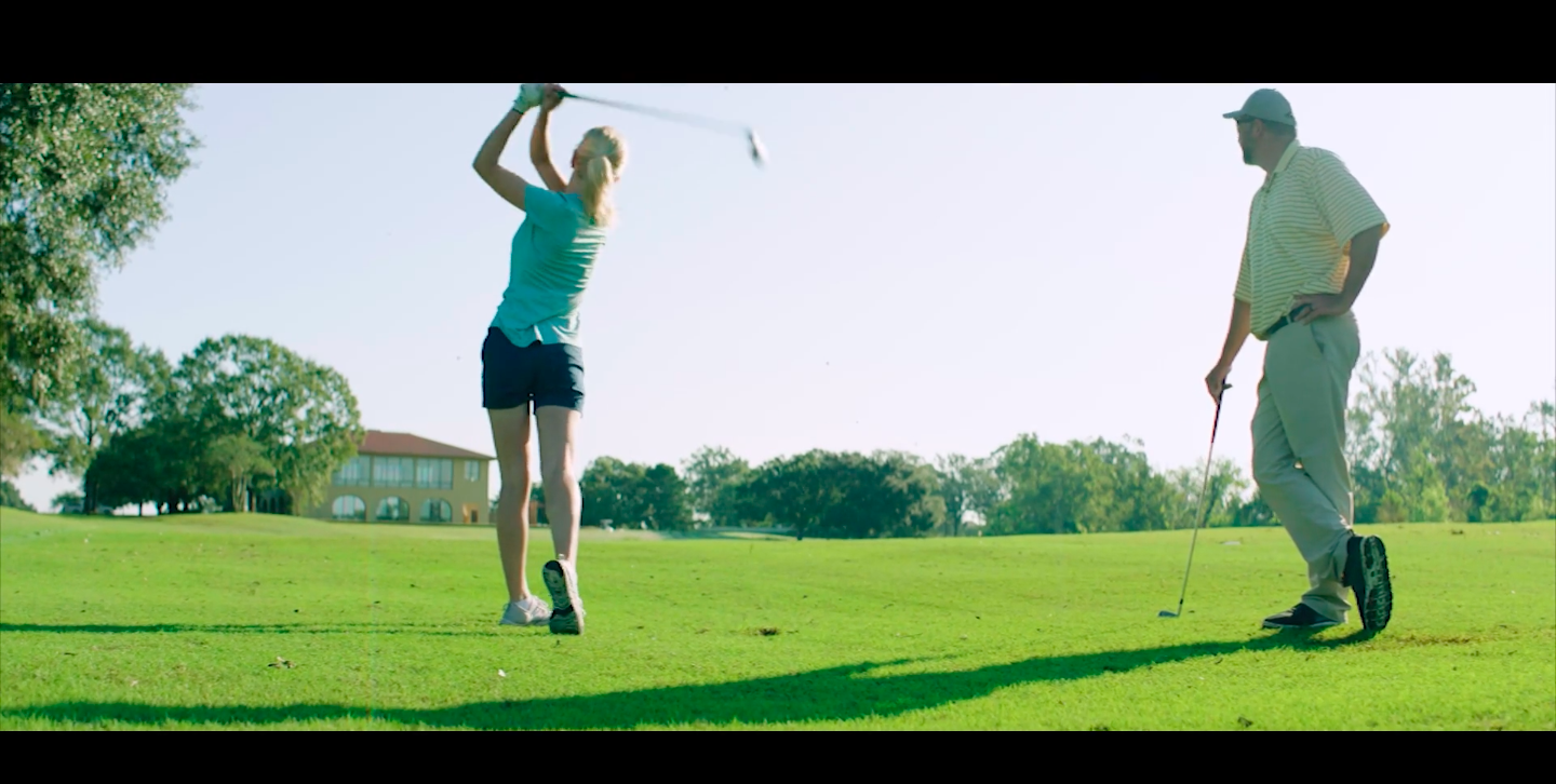 Older couple golfing in Live Action marketing video