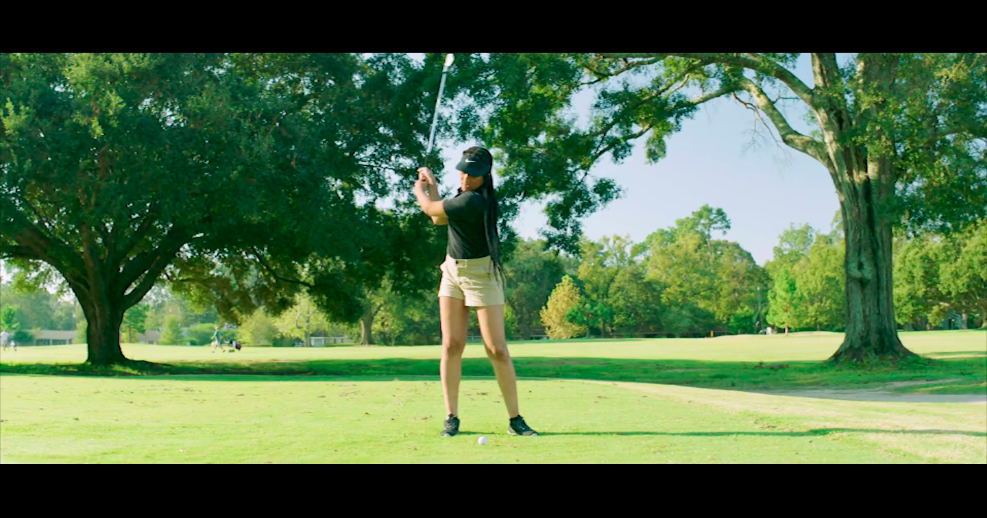 African American woman golfing in Live Action marketing video